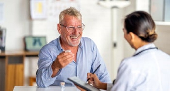 senior_man_discusses_medication_1414113165